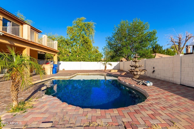 view of pool with a fenced in pool, a patio area, and a fenced backyard