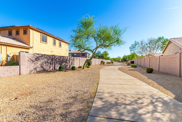 view of yard with a fenced backyard