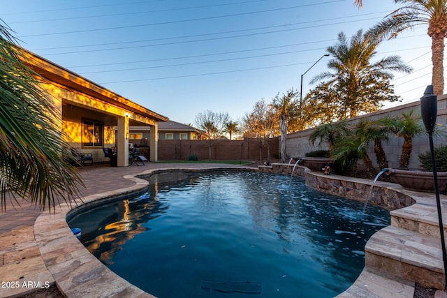 view of pool with pool water feature