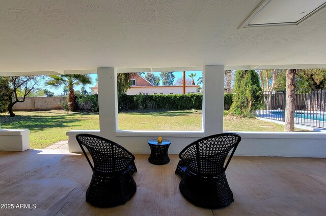 view of patio featuring a fenced in pool