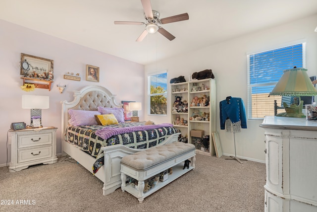 bedroom featuring light carpet and ceiling fan