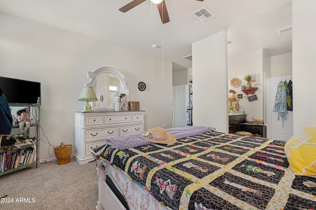 bedroom with ceiling fan and light carpet