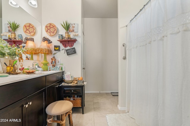 bathroom with tile patterned floors and vanity