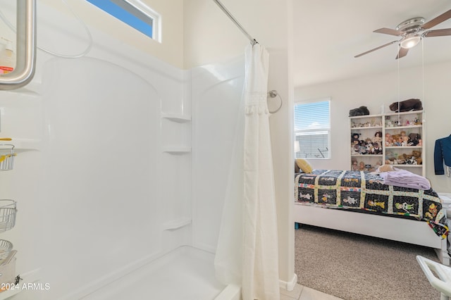 bathroom featuring a shower with shower curtain and ceiling fan