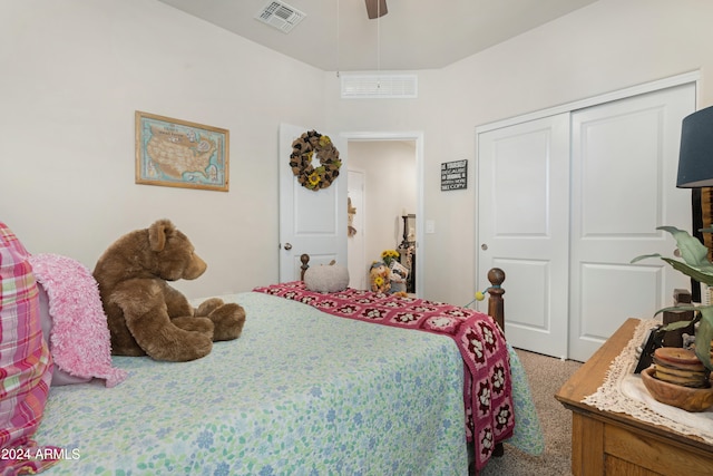 carpeted bedroom featuring ceiling fan and a closet