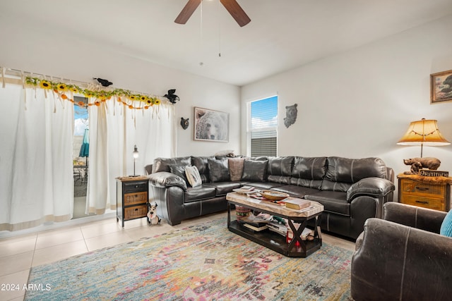 living room with light tile patterned floors and ceiling fan