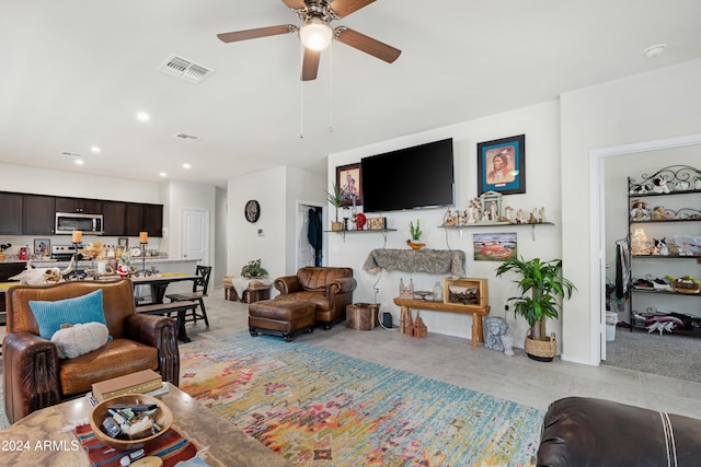 tiled living room with ceiling fan