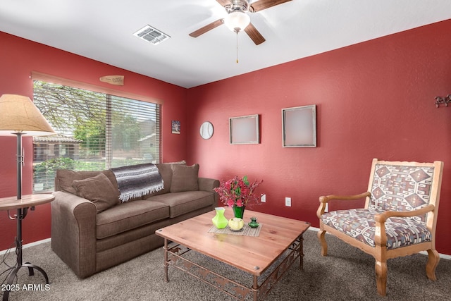 15994 W Bartlett Ave, Goodyear, AZ 85338 - living room with a textured wall, visible vents, a ceiling fan, and carpet floors