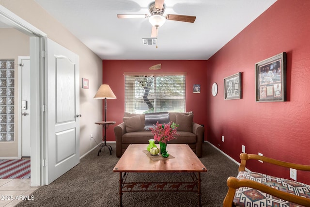 15994 W Bartlett Ave, Goodyear, AZ 85338 - living area with visible vents, ceiling fan, carpet floors, and baseboards