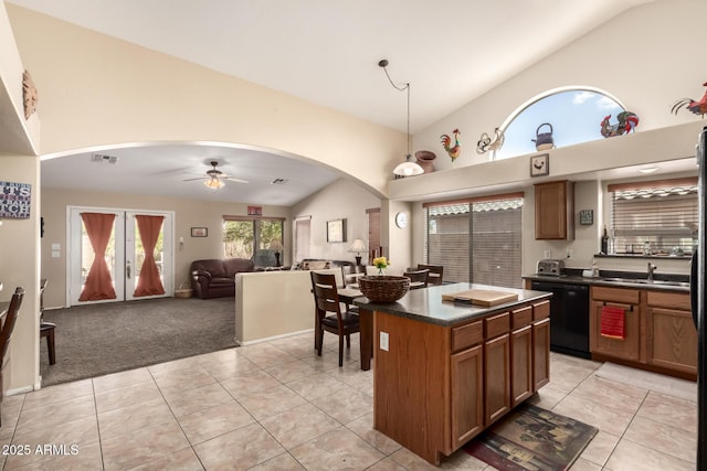 15994 W Bartlett Ave, Goodyear, AZ 85338 - kitchen featuring arched walkways, dishwasher, visible vents, and dark countertops