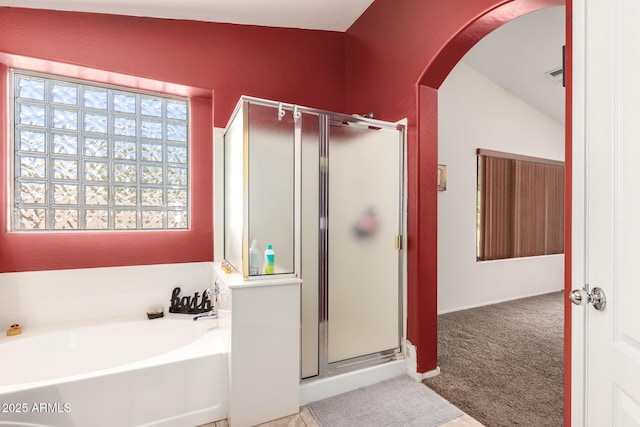 15994 W Bartlett Ave, Goodyear, AZ 85338 - full bath featuring a bath, vaulted ceiling, and a stall shower