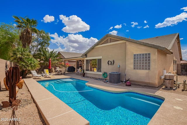15994 W Bartlett Ave, Goodyear, AZ 85338 - view of swimming pool featuring a fenced backyard, a fenced in pool, a patio, and central air condition unit
