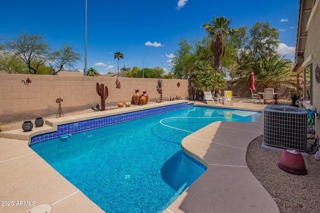 15994 W Bartlett Ave, Goodyear, AZ 85338 - view of swimming pool featuring a fenced in pool, a patio, central AC, and a fenced backyard