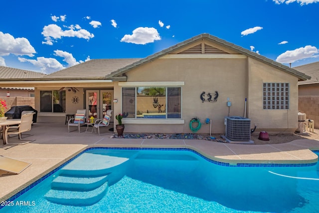 15994 W Bartlett Ave, Goodyear, AZ 85338 - rear view of property with a patio, stucco siding, an outdoor pool, cooling unit, and a tile roof