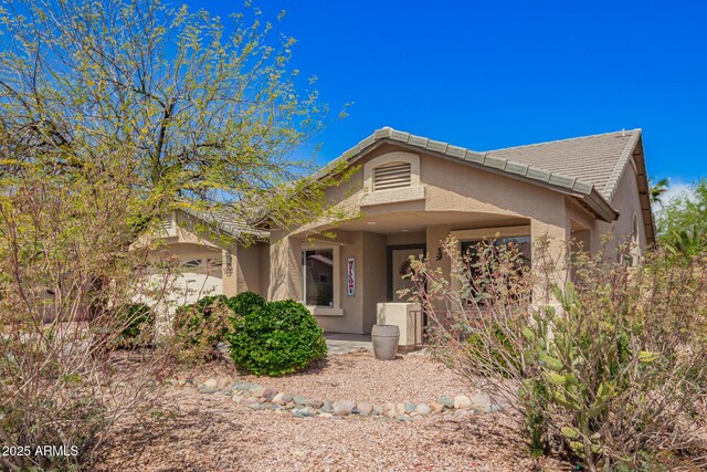 15994 W Bartlett Ave, Goodyear, AZ 85338 - view of front facade featuring a tile roof and stucco siding