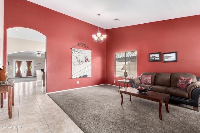 15994 W Bartlett Ave, Goodyear, AZ 85338 - living room featuring arched walkways, plenty of natural light, visible vents, and baseboards