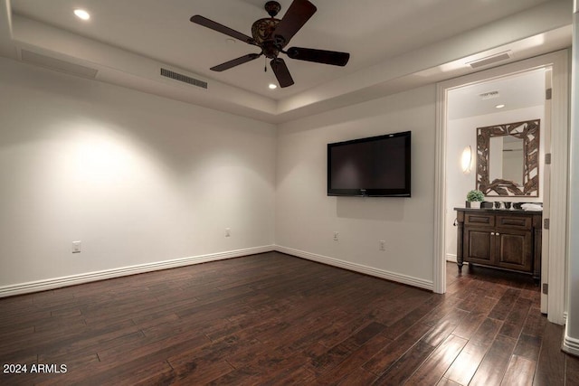 interior space with ceiling fan and dark wood-type flooring