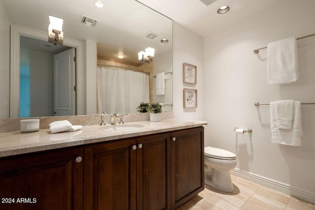 bathroom with tile patterned floors, walk in shower, vanity, and toilet