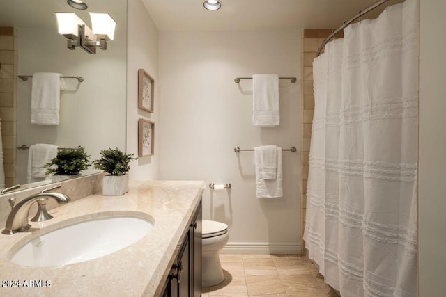 bathroom with a shower with curtain, tile patterned flooring, vanity, and toilet