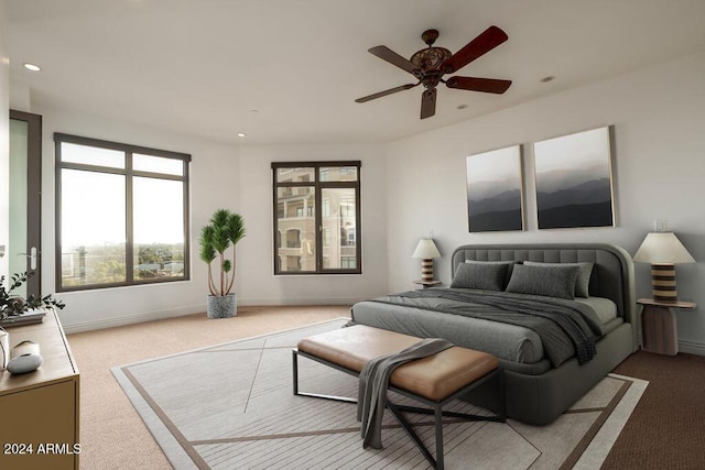 bedroom featuring light carpet and ceiling fan