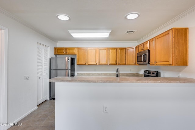 kitchen featuring kitchen peninsula, crown molding, light tile patterned flooring, and stainless steel appliances