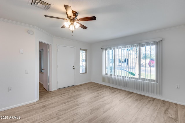 entrance foyer featuring light hardwood / wood-style flooring, ceiling fan, and ornamental molding