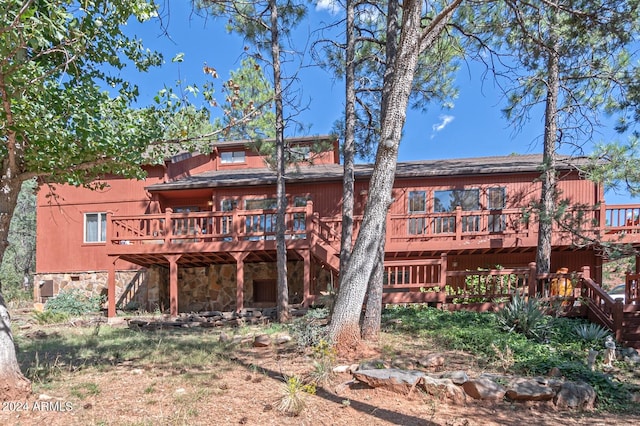 rear view of house with a deck