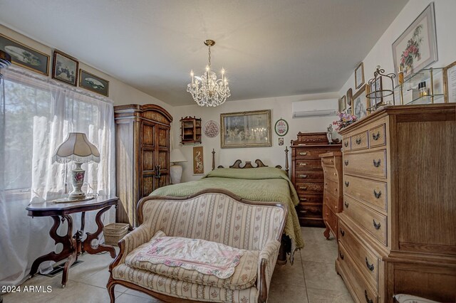 tiled bedroom featuring a wall mounted AC and an inviting chandelier