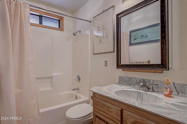 full bathroom with vanity, toilet, and shower / tub combo