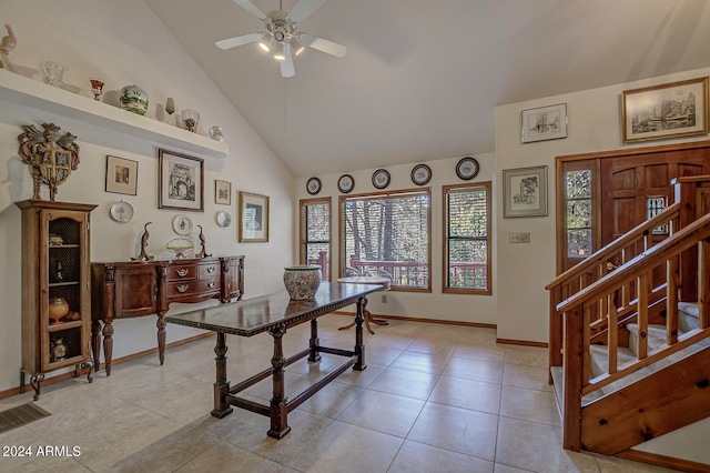 office space with high vaulted ceiling, light tile patterned floors, and ceiling fan