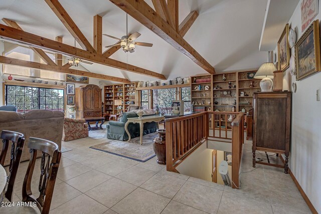 tiled living room with beamed ceiling, high vaulted ceiling, and ceiling fan