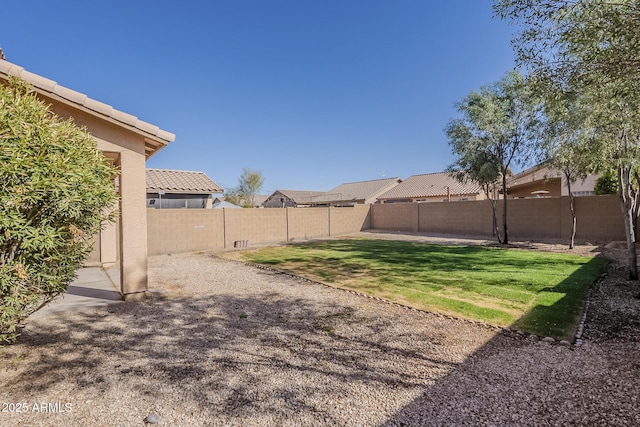 view of yard with a fenced backyard