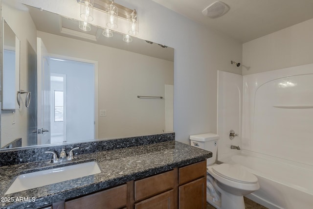 bathroom with vanity, toilet, and shower / bathtub combination