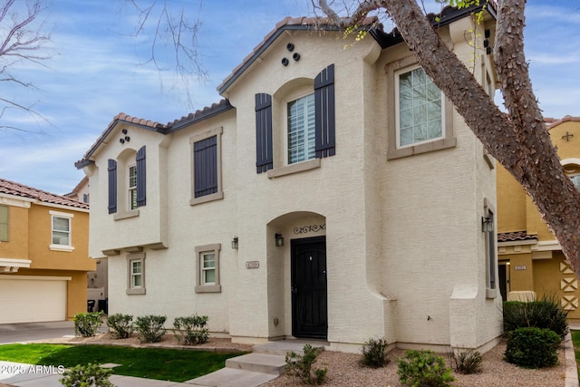 view of front of home featuring a tile roof and stucco siding