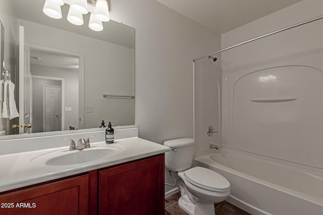 bathroom featuring vanity, shower / bathing tub combination, toilet, and tile patterned flooring