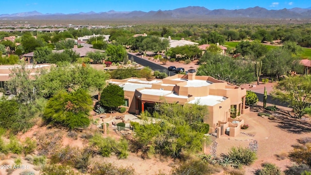 birds eye view of property featuring a mountain view