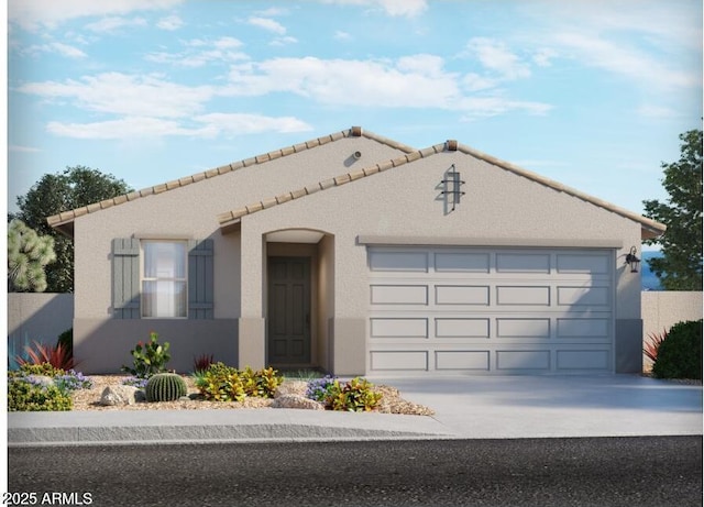 mediterranean / spanish-style house with a tile roof, concrete driveway, a garage, and stucco siding