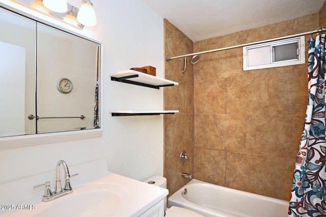 bathroom featuring vanity, shower / bath combo with shower curtain, and toilet