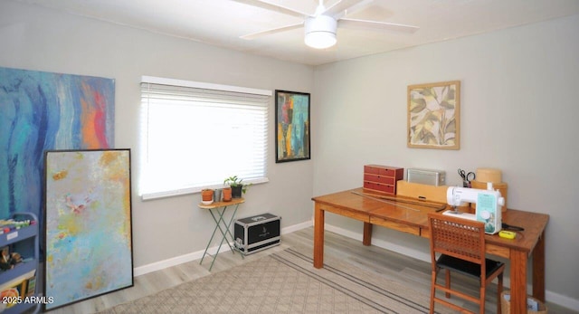 office with baseboards, a ceiling fan, and wood finished floors