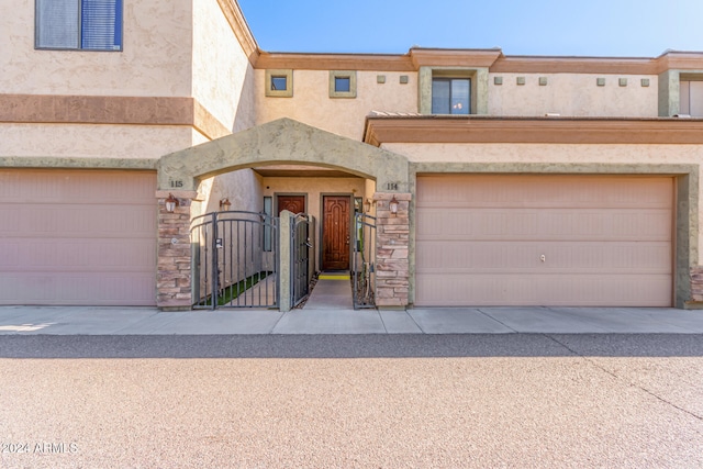 townhome / multi-family property featuring a garage