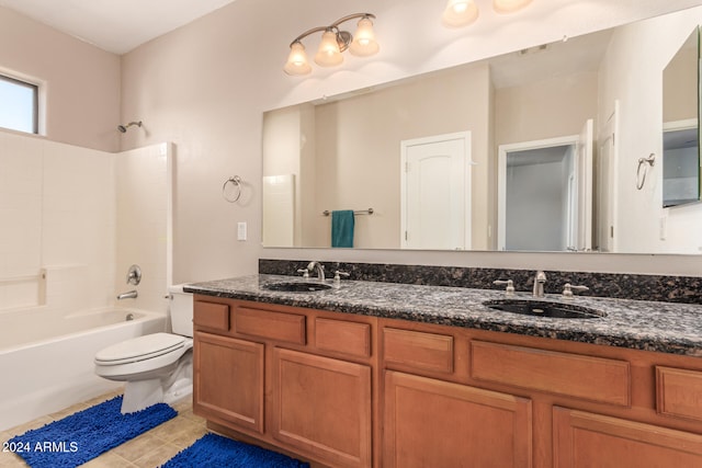 full bathroom featuring toilet, vanity, tile patterned floors, and shower / washtub combination