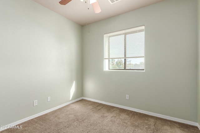 carpeted empty room with ceiling fan