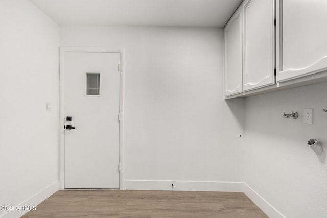 3008 S Saguaro Cir, Mesa, AZ 85202 - laundry room featuring cabinet space, baseboards, and light wood-style flooring