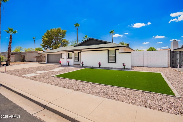 3008 S Saguaro Cir, Mesa, AZ 85202 - single story home with concrete driveway, an attached garage, and an area to practice putting