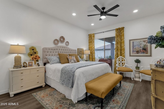 bedroom with dark hardwood / wood-style floors and ceiling fan