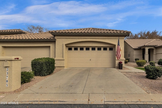 mediterranean / spanish-style home with a garage