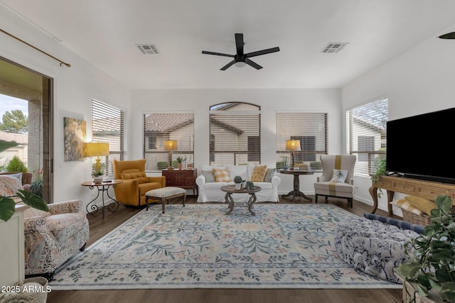 living room featuring ceiling fan and hardwood / wood-style floors