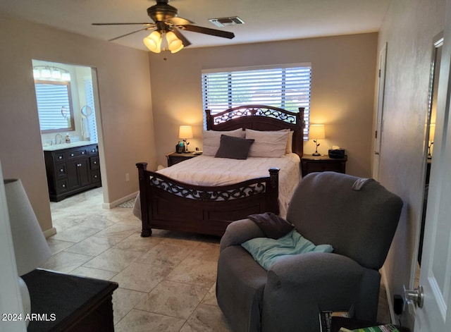 bedroom with ensuite bathroom and ceiling fan