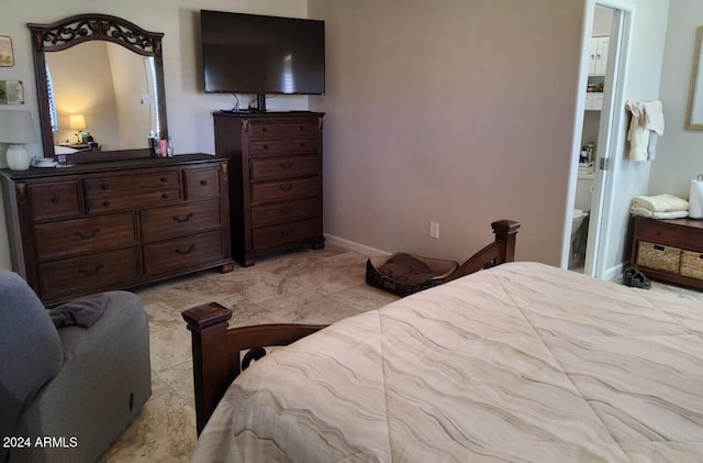 bedroom with connected bathroom