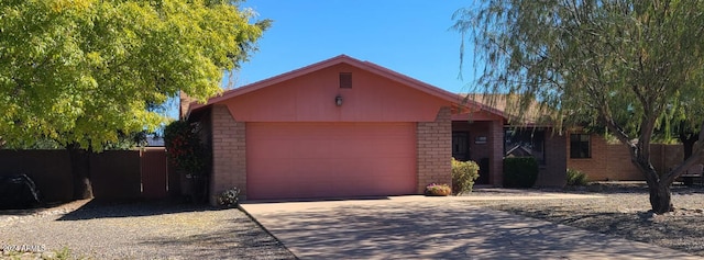 ranch-style house featuring a garage